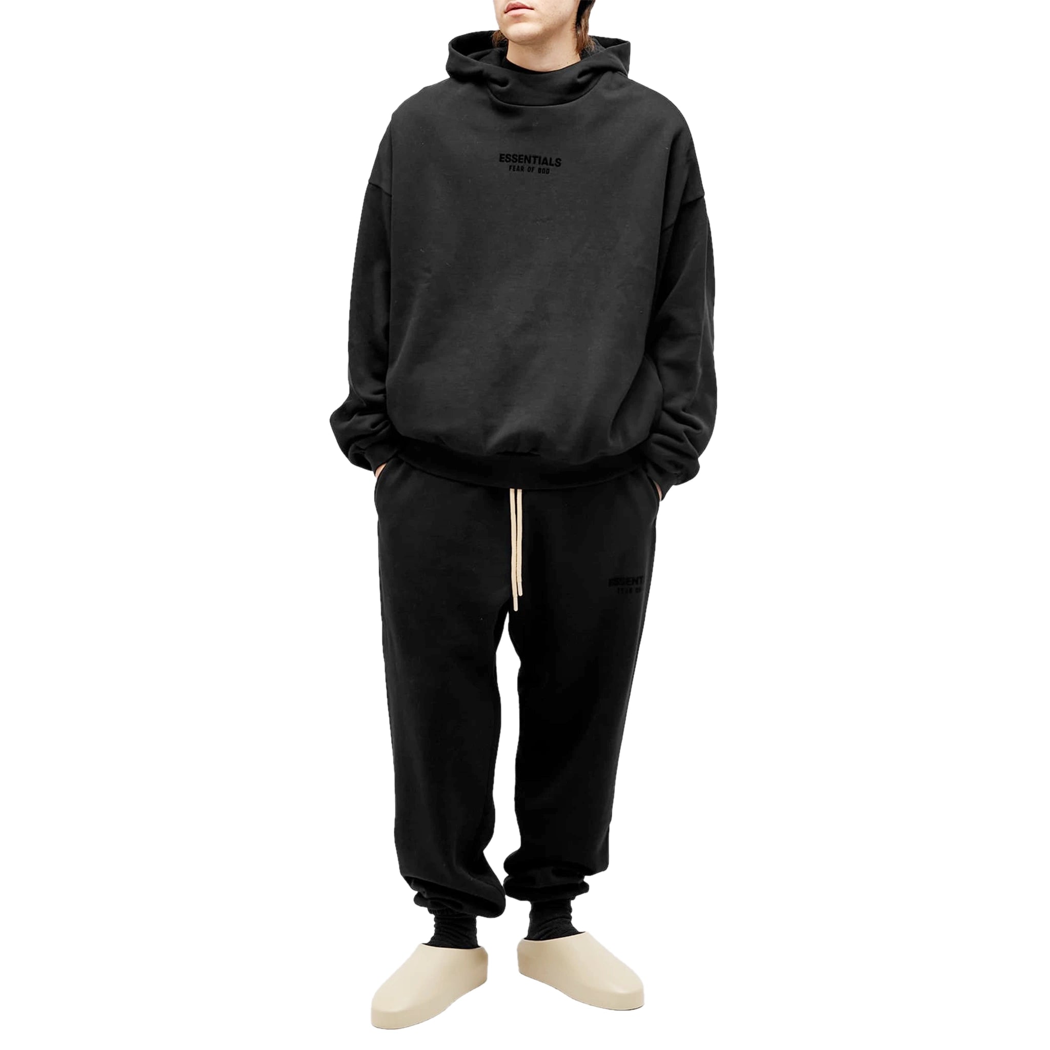 Model full view of Fear Of God Essentials Jet Black Hoodie (FW23)